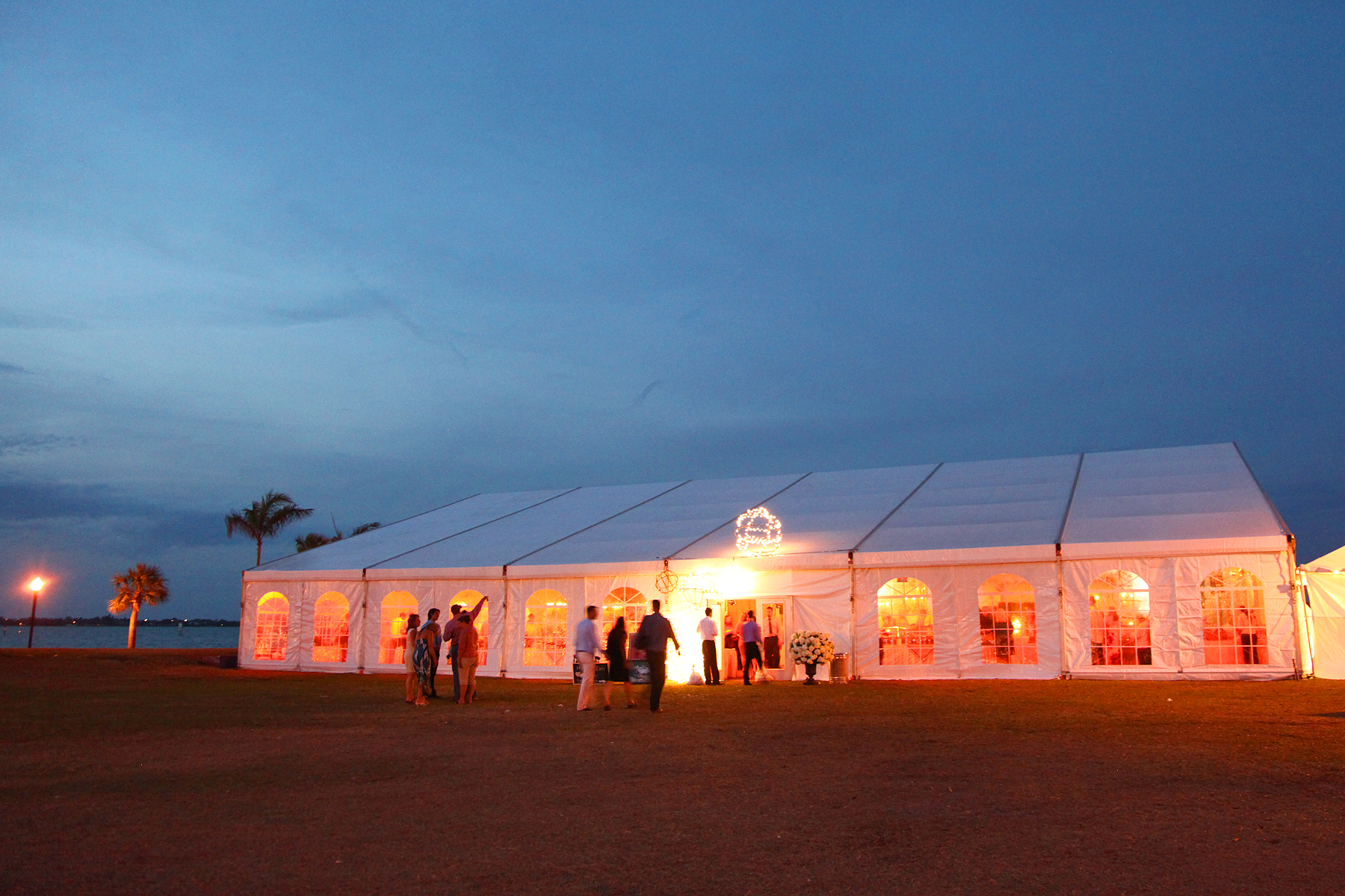 Wedding tent at Laishley park in the evening with guest in attendence.