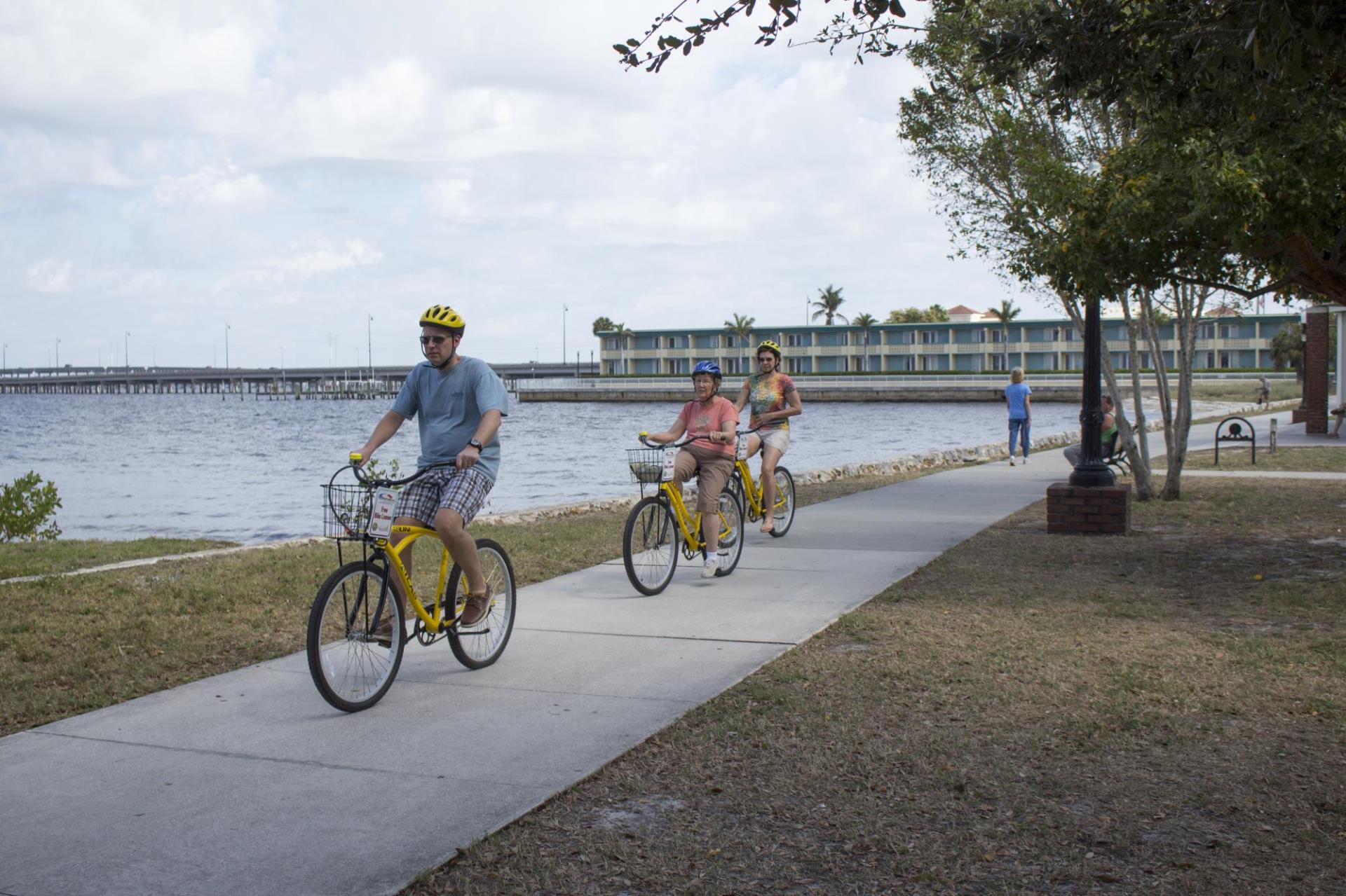 people biking along harbor at gilchrist park