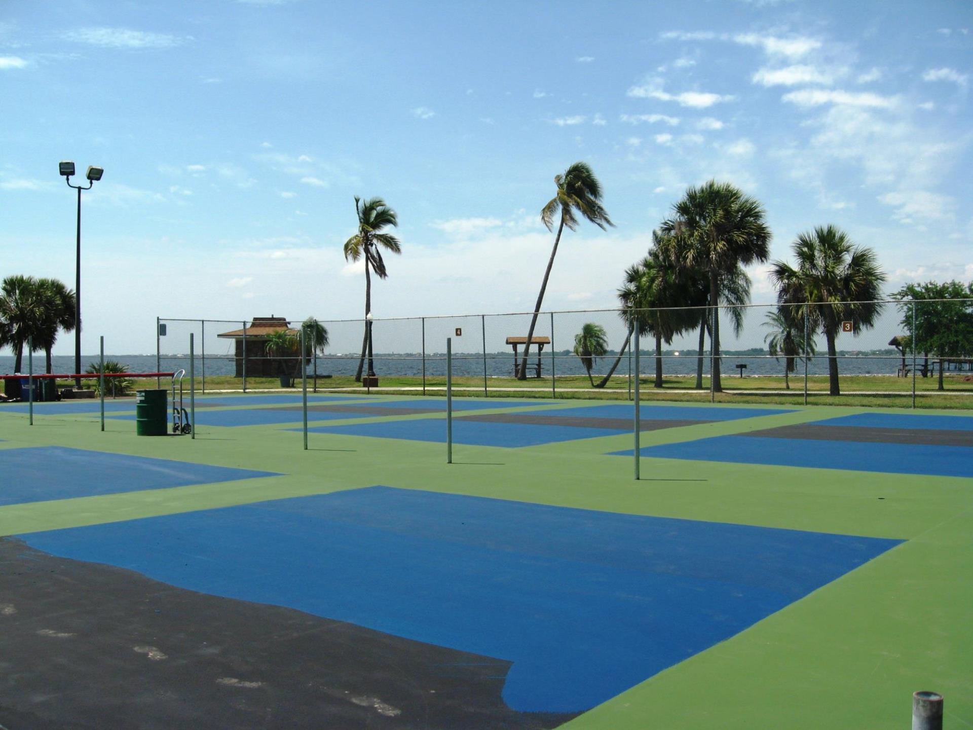 pickleball courts in gilchrist park next to water 