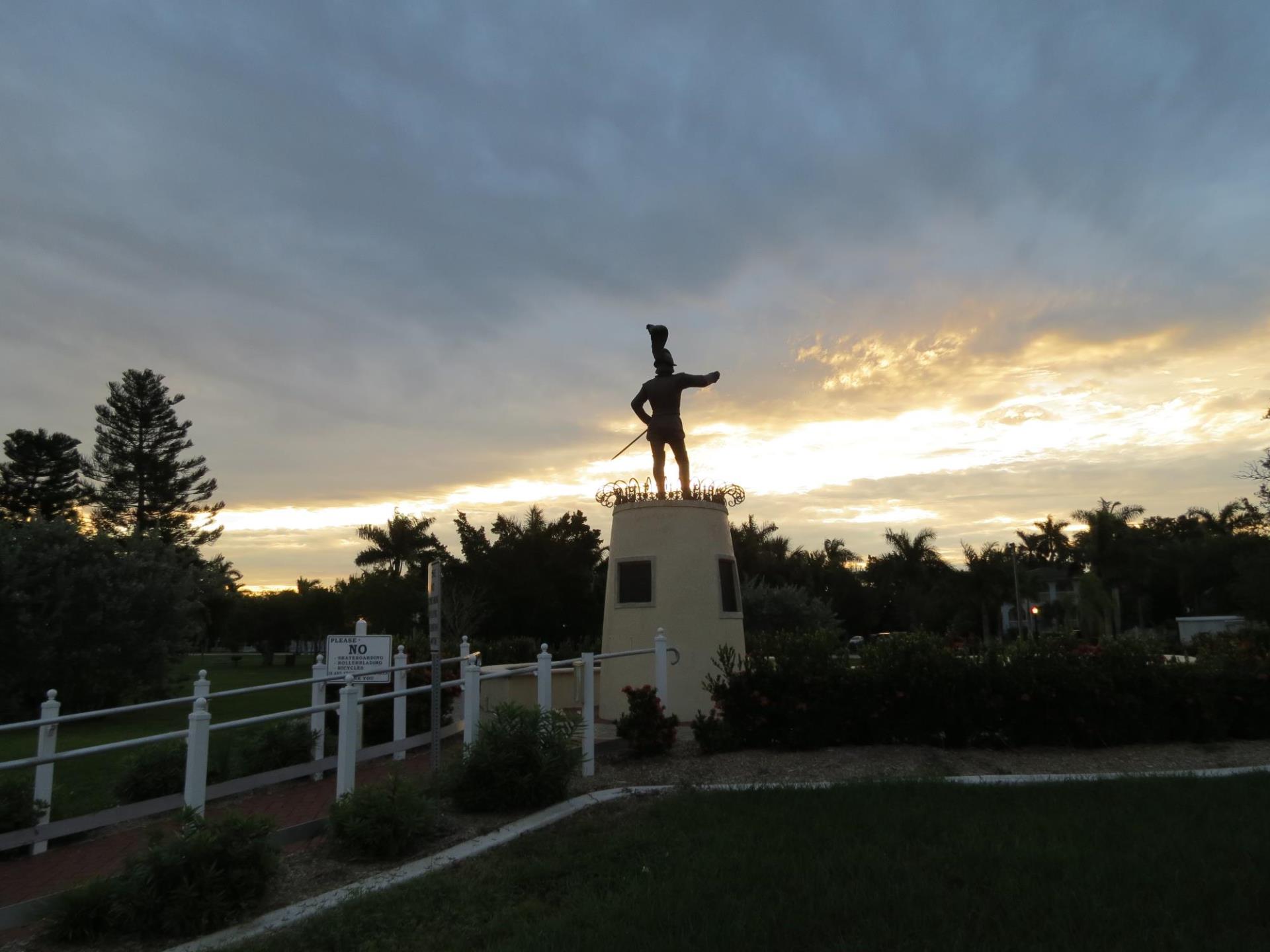 ponce statue at night with sunset in the background