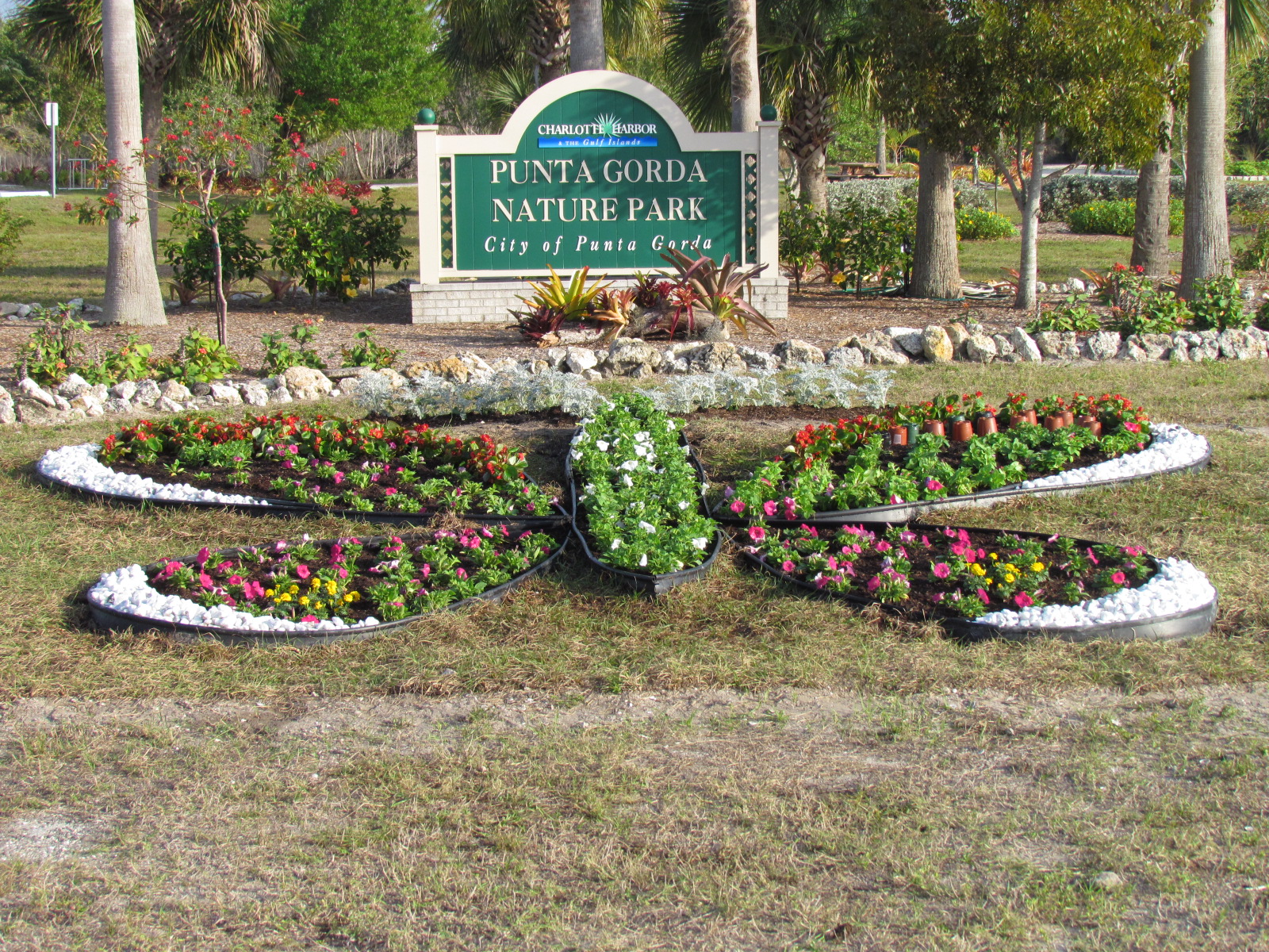 punta gorda nature park welcome sign and park in the backgorund