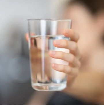 Drinking water in a glass